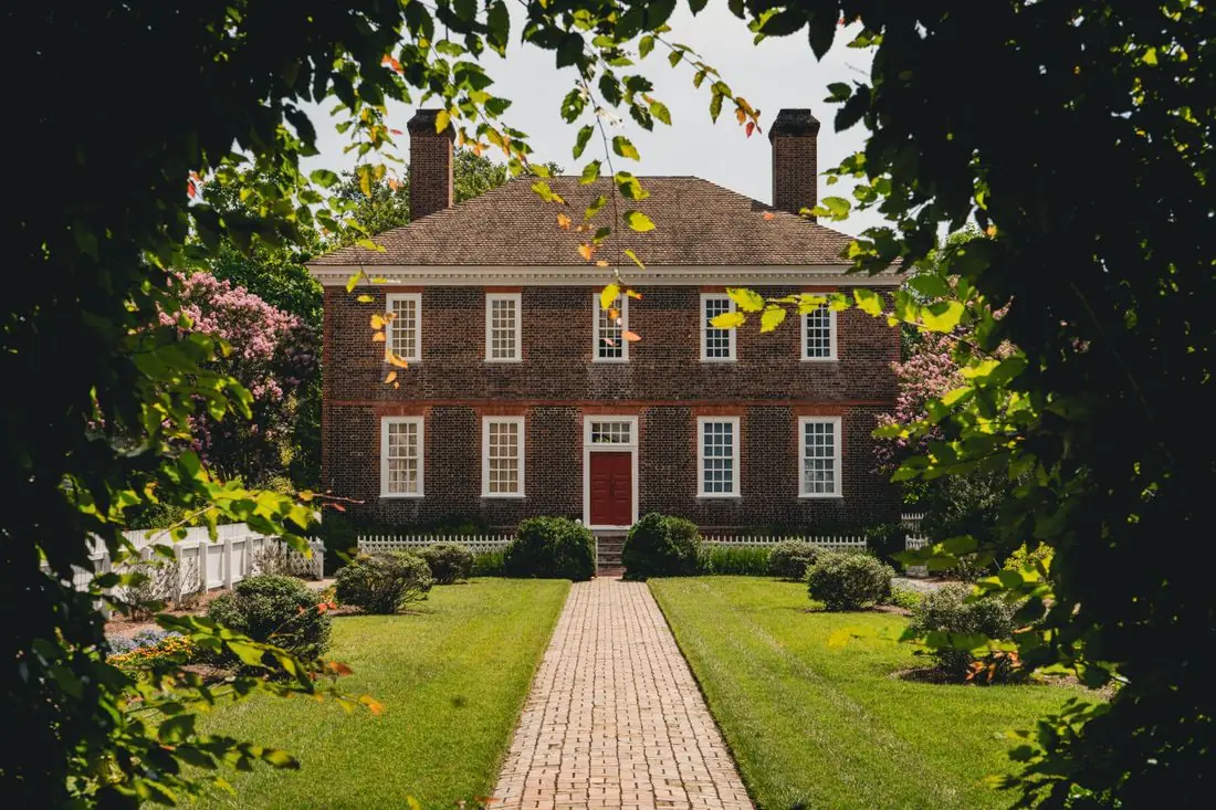 Red brick colonial house in New Jersey with two masonry chimneys